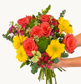 Vibrant bouquet of orange roses, yellow daisies, and lush greenery for cheerful occasions.